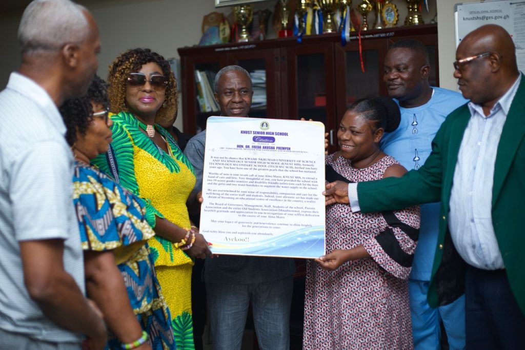 Hon, Dr, Freda Prempeh receiving a citation from Knust SHS staff  